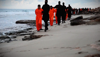 Egyptian captives are marched along a beach in Libya by ISG militants (Reuters/Social media via Reuters TV)