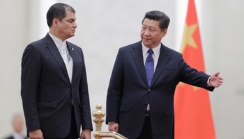 China's President Xi Jinping shows the way to Ecuador's President Rafael Correa during a welcoming ceremony (Reuters/Jason Lee)