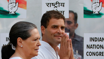 Congress party chief Sonia Gandhi and her son and vice-president of Congress Rahul Gandhi arrive to address a news conference in New Delhi (Reuters/Anindito Mukherjee)