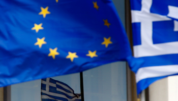 Greek and EU flags are seen outside the Foreign Ministry in Athens (Reuters/Yannis Behrakis)