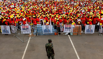 A soldier looks on as supporters of the ruling MPLA party attend the party's last rally (Reuters/Siphiwe Sibeko)