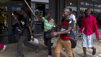 Men run from police during anti-foreigner violence in Durban (Reuters/Rogan Ward)