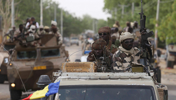 Chadian soldiers drive in the recently retaken town of Damasak, Nigeria (Reuters/Emmanuel Braun)