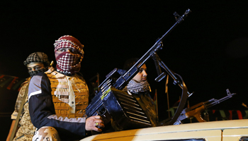 Members of a militia group hold their weapons in Freedom Square in Benghazi (Reuters/Esam Omran Al-Fetori)