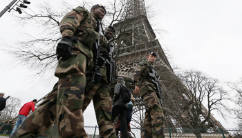 French soldiers patrol near the Eiffel Tower in Paris (Reuters/Gonzalo Fuentes)