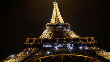 Lights on the Eiffel Tower read, "Paris Climat 2015" (Reuters/Jacky Naegelen)