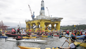 Activists protest the Shell Oil Company's drilling rig in Seattle (REUTERS/Jason Redmond)