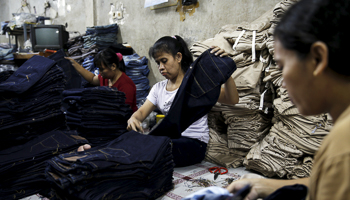 A worker at a small factory at Cakung industrial village in Jakarta (REUTERS/Beawiharta)