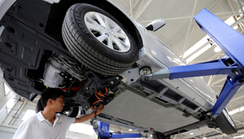 An employee at a factory of Beijing Automotive Industry Holding Co in China (Reuters/China Daily)