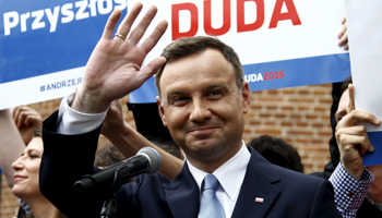 Andrzej Duda waves during his election campaign (Reuters/Kacper Pempel)