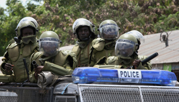 Tanzanian policemen patrol a street in Tandika neighbourhood (Reuters/Emmanuel Kwitema)
