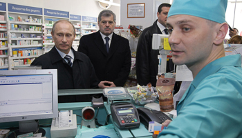 Vladimir Putin visits a pharmacy in Murmansk, Russia (Reuters/RIA Novosti/Pool/Alexei Nikolsky)