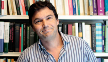 French economist Thomas Piketty poses in his office in Paris (Reuters/Charles Platiau)