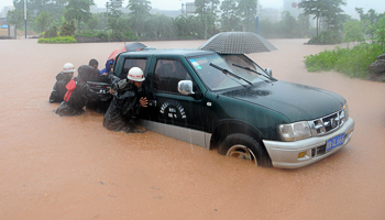 A vehicle on a flooded street in Qinzhou, Guangxi Zhuang Autonomous Region, China (Reuters/Stringer)