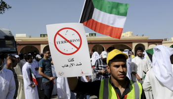 A mourner during the funeral for victims of the bombing, Al Jafariya cemetery in Suleibikhat (Reuters/Jassim Mohammed)