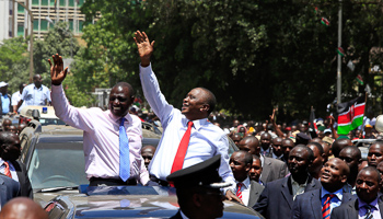 Kenyatta and Ruto wave to crowds of supporters in Nairobi (Reuters/Noor Khamis)