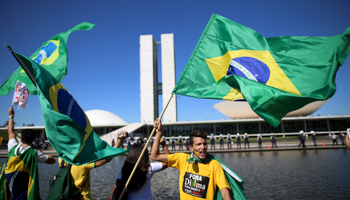 Anti-government demonstrators wave Brazilian flags during a protest against Brazil's President Dilma Rousseff (Reuters/Adriano Machado)