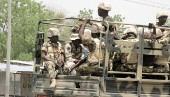 Soldiers are seen on a truck in Maiduguri in Borno State (Reuters/Stringer)