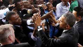 A crowd surges toward Barack Obama as he greets the audience after his remarks at a stadium in Nairobi (Reuters/Jonathan Ernst)