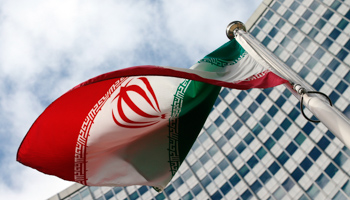 An Iranian flag flutters in front of the United Nations headquarters in Vienna (Reuters/Heinz-Peter Bader)