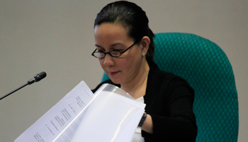 Philippine Senator Grace Poe examining a report (Reuters/Romeo Ranoco)