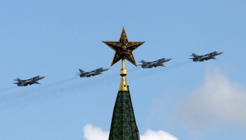 Russian military jets fly in formation with a tower of the Kremlin seen in the foreground, central Moscow (Reuters/Tatyana Makeyeva)