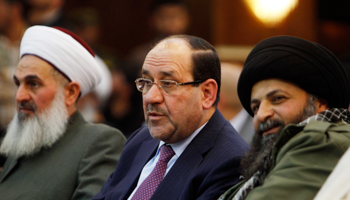 Nuri al-Maliki between Hamid al-Jazaeiri and al-Khorasani in Baghdad (Reuters/Ahmed Saad)