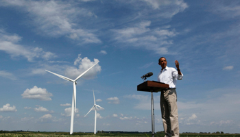 Barack Obama talks to the media on the Heil Family Farm, a wind farm, in Haverhill, Iowa (Reuters/Larry Downing)