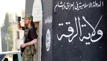 Islamist fighter films a military parade in Syria (Reuters/Stringer)