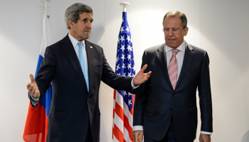 U.S. Secretary of State John Kerry (L) talks to Russia's Foreign Minister Sergey Lavrov(Reuters/Fabrice Coffrini/Pool)