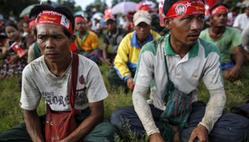 Supporters wait for Myanmar opposition leader Aung San Suu Kyi to give a speech as she campaigns for the upcoming general election (Reuters/Soe Zeya Tun)