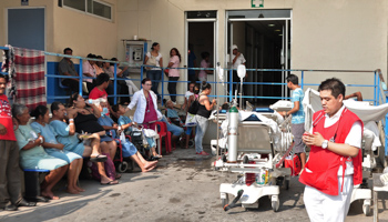 Patients sit together outside a hospital in Acapulco, Guerrero state (Reuters/Jesus Solano)