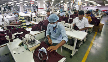 Employees in a garment factory on the outskirts of New Delhi (Reuters/Anindito Mukherjee)