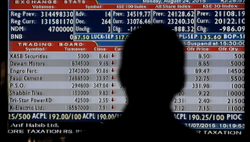 A man monitors stock prices in the halls of Karachi Stock Exchange, Pakistan (Reuters/Akhtar Soomro)