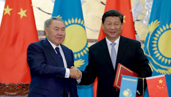 Chinese President Xi Jinping shakes hands with Kazakhstan President Nursultan Nazarbayev during a signing ceremony at the Great Hall of the People in Beijing (Reuters/Lintao Zhang/Pool)