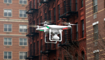 A camera drone flies over the site of a gas explosion in Harlem, New York, in March 2014 (Reuters/Mike Segar)
