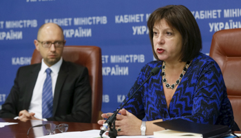 Ukraine's Finance Minister Natalia Yaresko and Prime Minister Arseny Yatseniuk attend a news conference in Kiev (Reuters/Valentyn Ogirenko)