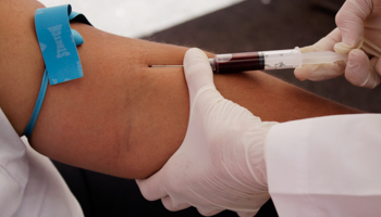 A nurse takes blood for a free HIV test, during an HIV/AIDS awareness rally in San Salvador (Reuters/Luis Galdamez)