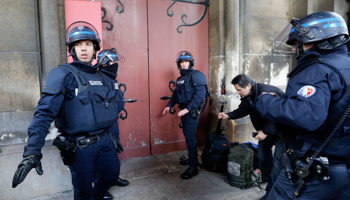 French police at the Eglise Neuve church in Saint-Denis, Paris, on November 18, as they secure the area during an operation in pursuit of fugitives from the November 13 terror attacks (Reuters/Jacky Naegelen)
