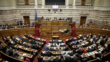 Greek lawmakers attend a parliamentary session for a reforms bill vote in Athens (Reuters/Alkis Konstantinidis)