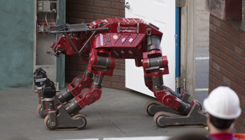 The Tartan Rescue team, Highly Intelligent Mobile Platform robot, on the DARPA Robotics Challenge finals in Pomona, California (Reuters/David McNew)