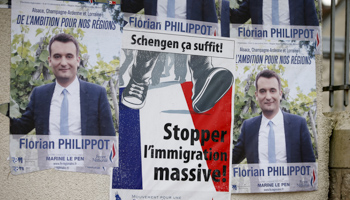 Electoral posters for regional elections of French far-right National Front political party vice-president Florian Philippot (Reuters/Charles Platiau)