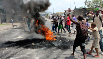 Demonstrators burn tyres to set up barricades during a protest in Kinshasa (Reuters/Jean Robert N'Kengo)