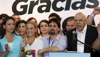 Jesus Torrealba and Lilian Tintori after winning control of the legislature from the ruling Socialists (Reuters/Carlos Garcia Rawlins)