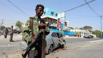 A policeman secures the scene of a car bomb explosion near Taleex junction in the capital Mogadishu (Reuters/Feisal Omar)