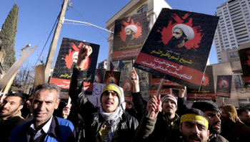 Iranian protesters chant slogans and hold pictures of Shi'ite cleric Sheikh Nimr al-Nimr during a demonstration against the execution of Nimr in Saudi Arabia (Reuters/Raheb Homavandi)