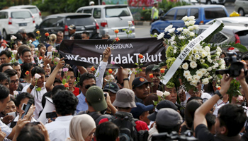 A rally at the scene of Thursday's gun and bomb attack in central Jakarta, Indonesia (Reuters/Darren Whiteside)