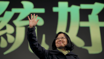 Democratic Progressive Party Chairperson and presidential candidate Tsai Ing-wen waves to her supporters after her election victory at party headquarters in Taipei (Reuters/Damir Sagolj)