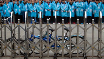 Workers protest at a factory in Guangdong (Reuters/Alex Lee)