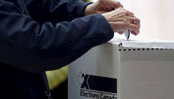 A voter at a polling station in Quebec City (Reuters/Mathieu Belanger)